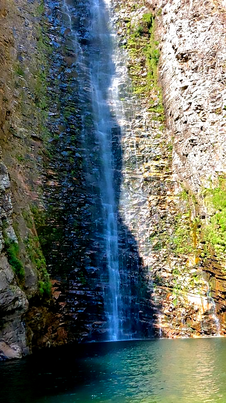 Segredo Falls in dry season — exposed cliff and crystal pool, Chapada dos Veadeiros