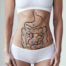 Corpo feminino com desenho do sistema digestivo